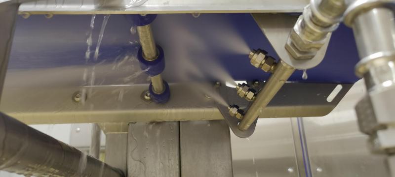 automatic conveyor cleaning system
